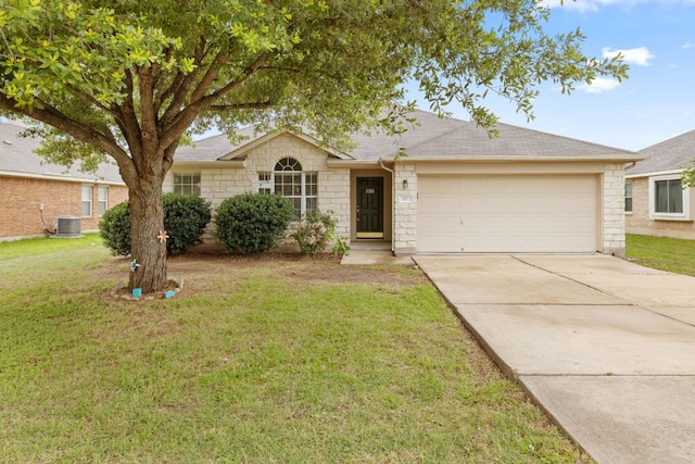 117 Kerley Dr, Hutto, TX 78634 - ranch-style home featuring central air condition unit, an attached garage, concrete driveway, a front yard, and stone siding