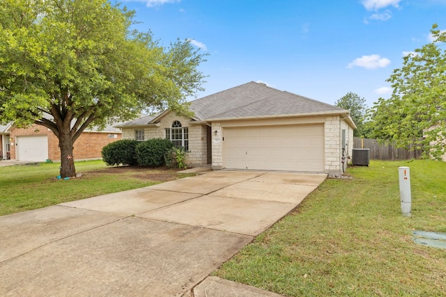 117 Kerley Dr, Hutto, TX 78634 - ranch-style house with an attached garage, stone siding, driveway, central air condition unit, and roof with shingles