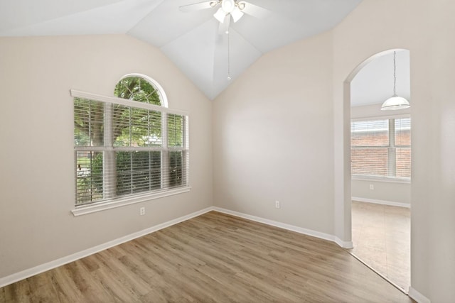 117 Kerley Dr, Hutto, TX 78634 - unfurnished room with plenty of natural light, ceiling fan, arched walkways, light wood-type flooring, and lofted ceiling