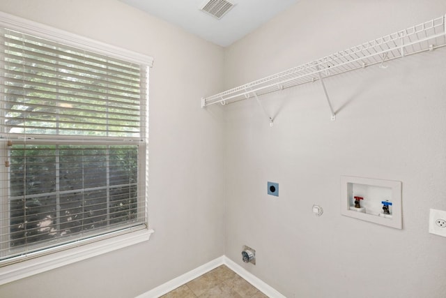 117 Kerley Dr, Hutto, TX 78634 - washroom with hookup for an electric dryer, washer hookup, hookup for a gas dryer, and baseboards