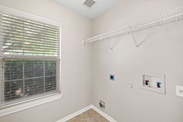 117 Kerley Dr, Hutto, TX 78634 - laundry area with electric dryer hookup, hookup for a washing machine, gas dryer hookup, and tile patterned floors