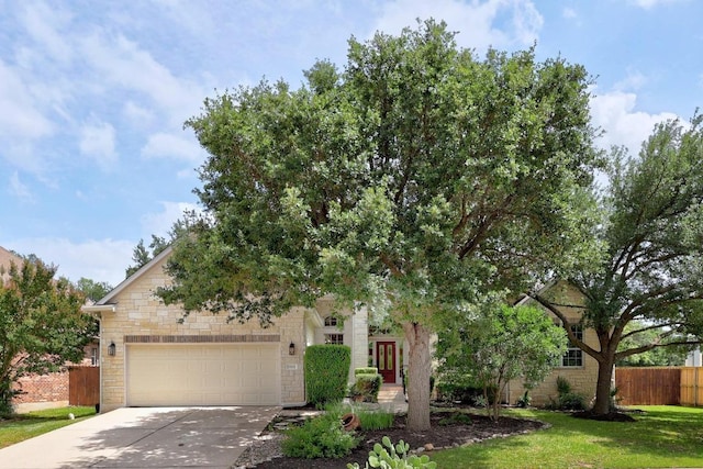 15901 Double Eagle Dr, Austin, TX 78717 - obstructed view of property featuring concrete driveway, an attached garage, stone siding, and french doors