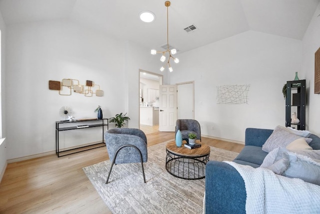 15901 Double Eagle Dr, Austin, TX 78717 - living area with a chandelier, light wood-type flooring, baseboards, and high vaulted ceiling