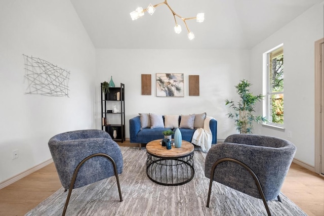 15901 Double Eagle Dr, Austin, TX 78717 - living room featuring lofted ceiling, wood finished floors, baseboards, and a chandelier