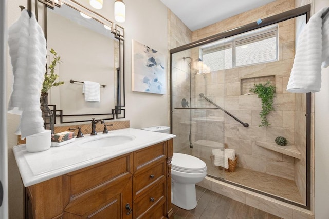 15901 Double Eagle Dr, Austin, TX 78717 - full bathroom with vanity, toilet, a stall shower, and wood finished floors