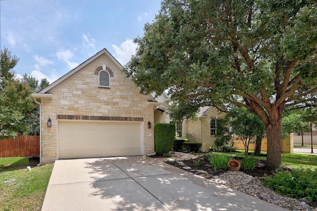 15901 Double Eagle Dr, Austin, TX 78717 - view of front of house with concrete driveway, stone siding, and a garage