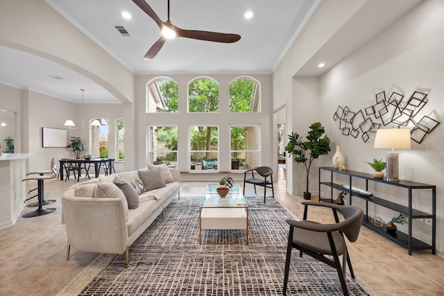 15901 Double Eagle Dr, Austin, TX 78717 - living area with crown molding, a ceiling fan, recessed lighting, baseboards, and arched walkways