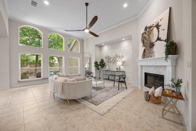15901 Double Eagle Dr, Austin, TX 78717 - living area featuring ornamental molding, ceiling fan, a high end fireplace, tile patterned floors, and recessed lighting