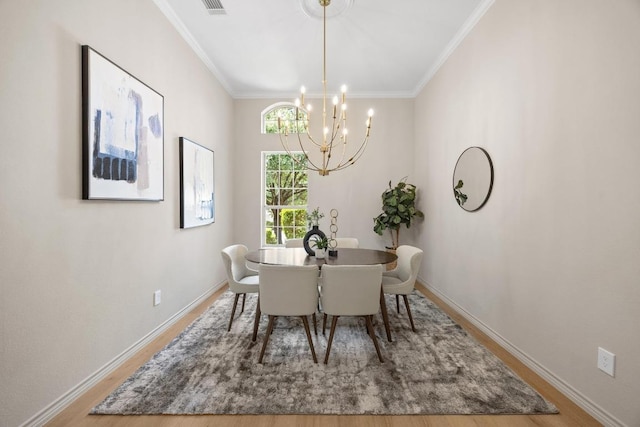 15901 Double Eagle Dr, Austin, TX 78717 - dining room featuring a chandelier, wood finished floors, crown molding, and baseboards