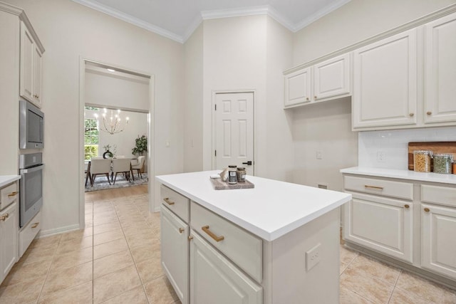 15901 Double Eagle Dr, Austin, TX 78717 - kitchen with appliances with stainless steel finishes, a chandelier, light countertops, a center island, and ornamental molding