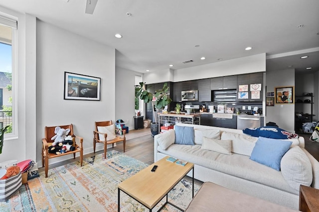 1800 E 4th St Unit 335, Austin, TX 78702 - living room with recessed lighting, light wood-style flooring, and ceiling fan