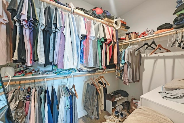 1800 E 4th St Unit 335, Austin, TX 78702 - walk in closet featuring wood finished floors