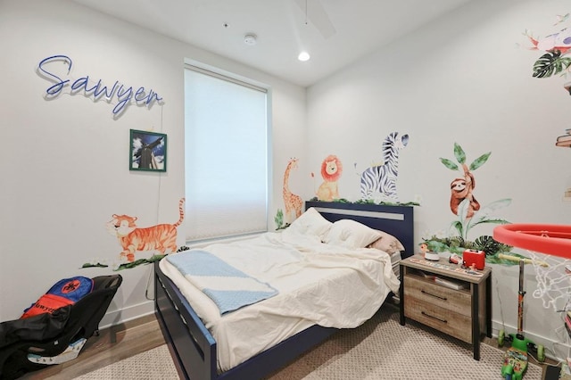 1800 E 4th St Unit 335, Austin, TX 78702 - bedroom featuring baseboards, recessed lighting, wood finished floors, and ceiling fan