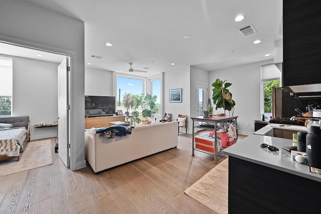 1800 E 4th St Unit 335, Austin, TX 78702 - living area with a ceiling fan, plenty of natural light, light wood-style flooring, and recessed lighting