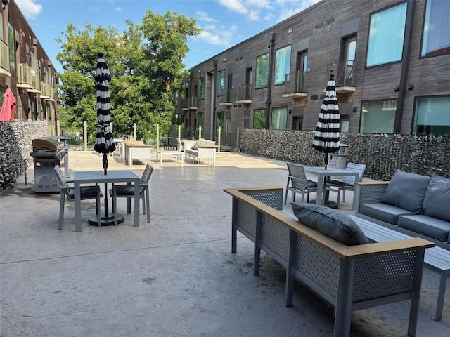 1800 E 4th St Unit 335, Austin, TX 78702 - view of patio featuring outdoor dining space, area for grilling, and an outdoor living space
