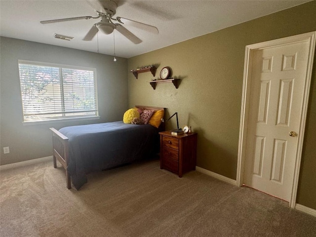 2619 Henley Dr, Round Rock, TX 78681 - carpeted bedroom with baseboards and a ceiling fan