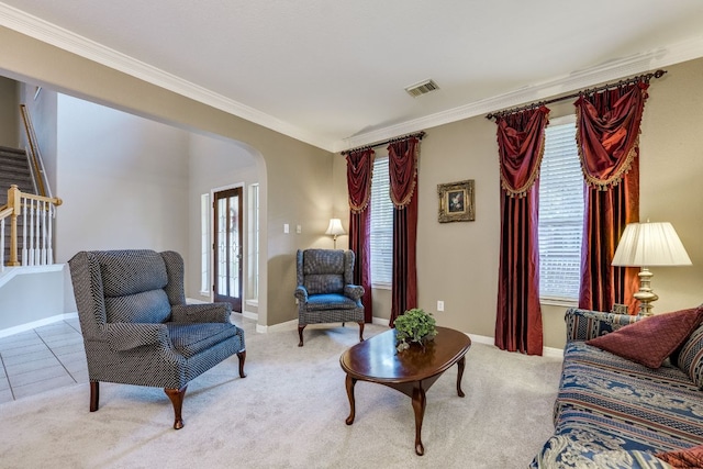 2619 Henley Dr, Round Rock, TX 78681 - carpeted living area featuring arched walkways, ornamental molding, and stairs