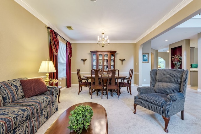 2619 Henley Dr, Round Rock, TX 78681 - dining area with a chandelier, ornamental molding, and light carpet