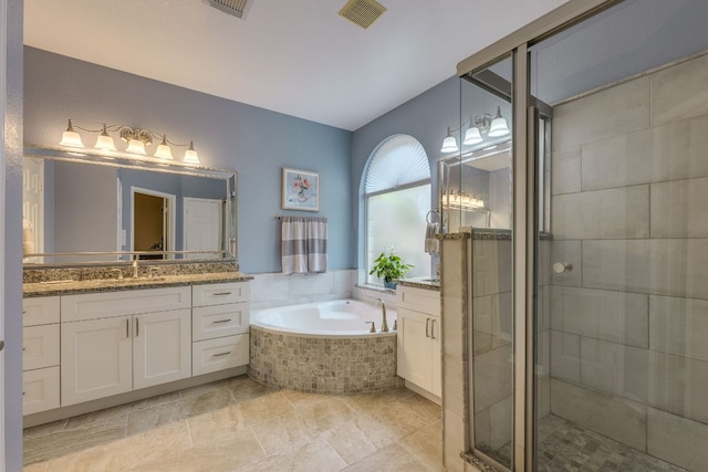 2619 Henley Dr, Round Rock, TX 78681 - full bath with vanity, a bath, and a stall shower