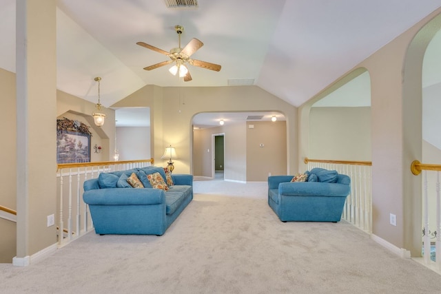 2619 Henley Dr, Round Rock, TX 78681 - carpeted living area with lofted ceiling, ceiling fan, and arched walkways