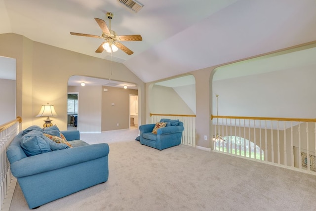 2619 Henley Dr, Round Rock, TX 78681 - carpeted living area featuring a ceiling fan, vaulted ceiling, and arched walkways