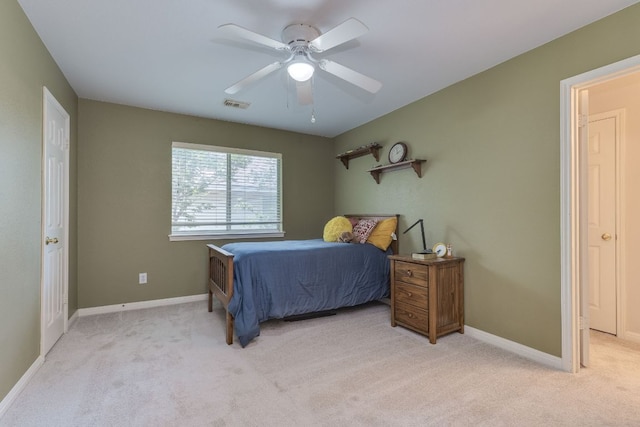 2619 Henley Dr, Round Rock, TX 78681 - bedroom with light colored carpet and a ceiling fan