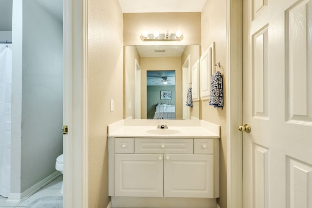 2619 Henley Dr, Round Rock, TX 78681 - ensuite bathroom with vanity, a ceiling fan, and tile patterned flooring