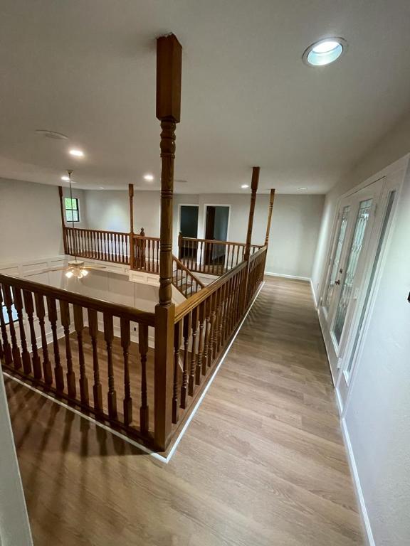 TBD County Road 246, Florence, TX 76527 - hall with wood finished floors, baseboards, an upstairs landing, and recessed lighting