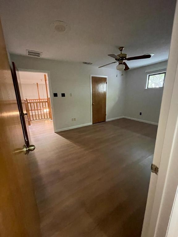 TBD County Road 246, Florence, TX 76527 - empty room with wood finished floors, baseboards, and ceiling fan