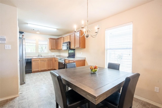 1524 Big Thicket Dr, Cedar Park, TX 78613 - dining area featuring a chandelier and baseboards