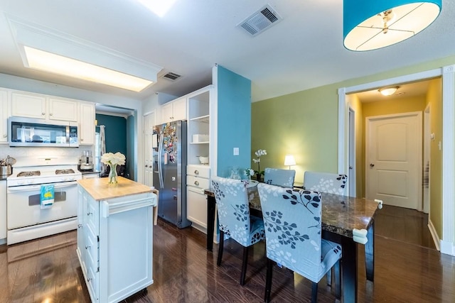 5013 Cleves St, Round Rock, TX 78681 - kitchen featuring appliances with stainless steel finishes, wood counters, white cabinetry, and dark wood-style flooring