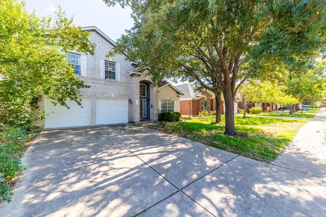5013 Cleves St, Round Rock, TX 78681 - traditional-style home with a garage, concrete driveway, and brick siding