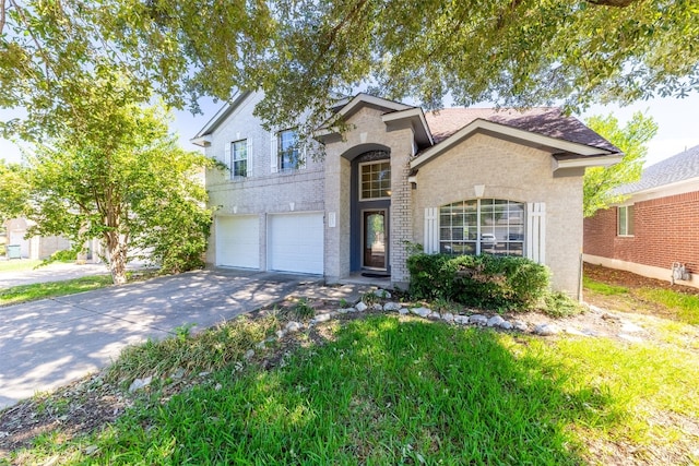 5013 Cleves St, Round Rock, TX 78681 - traditional home with brick siding, an attached garage, and driveway