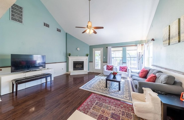 5013 Cleves St, Round Rock, TX 78681 - living area with high vaulted ceiling, wood finished floors, a ceiling fan, and a fireplace with raised hearth
