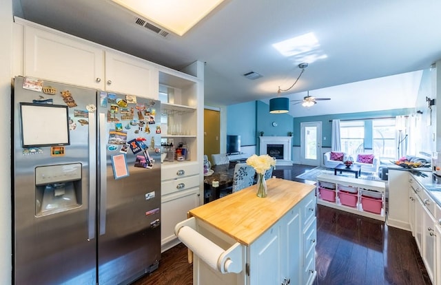 5013 Cleves St, Round Rock, TX 78681 - kitchen featuring stainless steel fridge with ice dispenser, butcher block countertops, ceiling fan, white cabinetry, and a fireplace