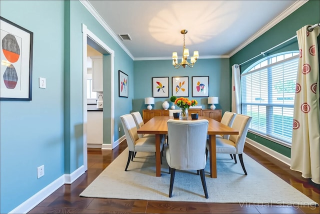 5013 Cleves St, Round Rock, TX 78681 - dining room with a chandelier, plenty of natural light, ornamental molding, and dark wood-type flooring