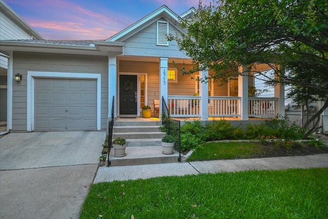 2713 Kinney Oaks Ct, Austin, TX 78704 - view of front of house featuring a porch, an attached garage, and driveway