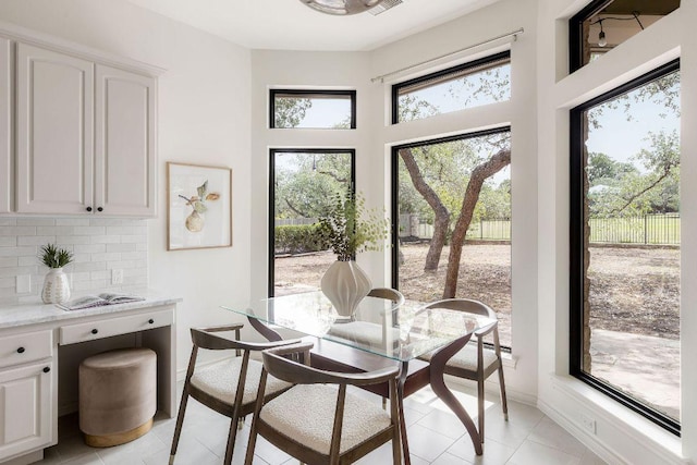 307 Malabar St, Lakeway, TX 78734 - dining space with light tile patterned floors and baseboards
