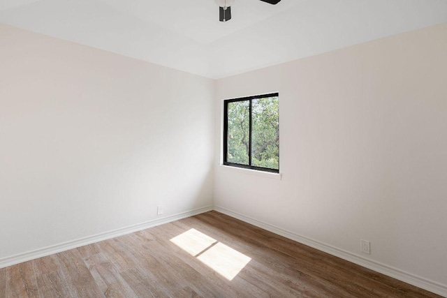 307 Malabar St, Lakeway, TX 78734 - spare room with wood finished floors, ceiling fan, and baseboards