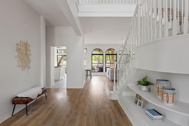 307 Malabar St, Lakeway, TX 78734 - hall featuring stairs, wood finished floors, and baseboards