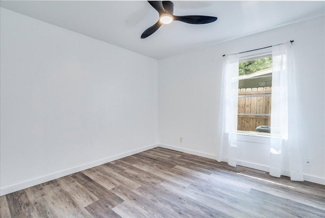 3210 Kay St, Austin, TX 78702 - spare room with wood finished floors and ceiling fan