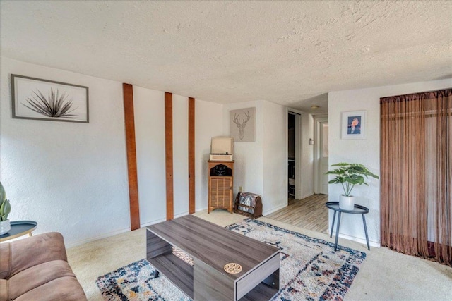 3210 Kay St, Austin, TX 78702 - living area featuring a textured ceiling and carpet floors