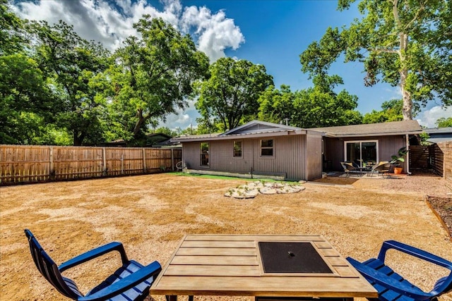 3210 Kay St, Austin, TX 78702 - rear view of house with a fenced backyard