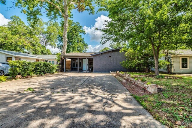 3210 Kay St, Austin, TX 78702 - view of front of house with driveway and brick siding