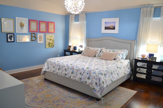 13501 Metric Blvd Unit 42, Austin, TX 78727 - bedroom with hardwood / wood-style flooring, a chandelier, and baseboards