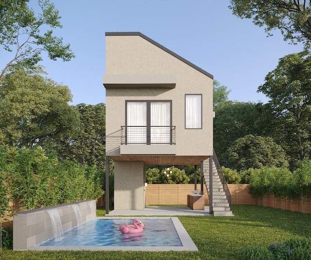 1213 Karen Ave, Austin, TX 78757 - view of front of property with a balcony, stucco siding, and a patio area