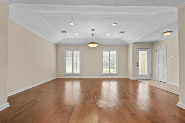 3601 Arrowhead Dr, Austin, TX 78731 - unfurnished living room featuring hardwood / wood-style floors, baseboards, lofted ceiling, recessed lighting, and crown molding