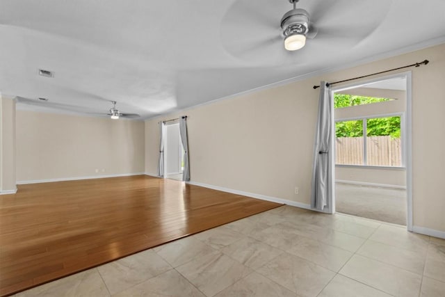 3601 Arrowhead Dr, Austin, TX 78731 - unfurnished living room featuring ceiling fan, crown molding, and baseboards