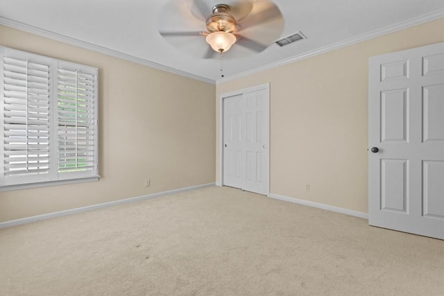 3601 Arrowhead Dr, Austin, TX 78731 - unfurnished bedroom featuring carpet flooring, crown molding, baseboards, a closet, and ceiling fan