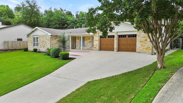 3601 Arrowhead Dr, Austin, TX 78731 - single story home with stone siding, an attached garage, and concrete driveway